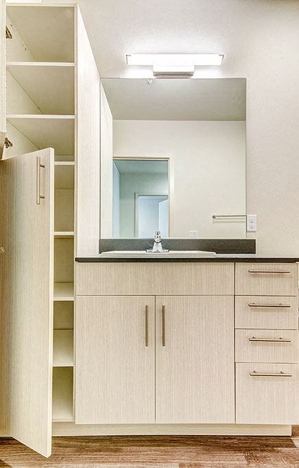 A kitchen with a sink and cabinets. at Ravello Apartments, Redmond, WA