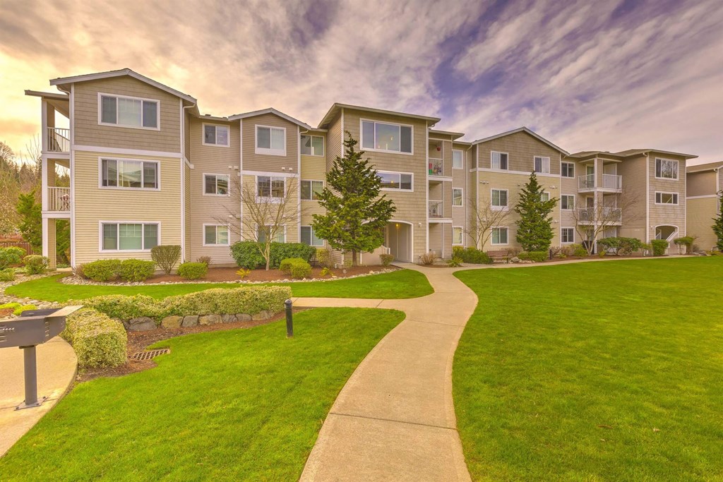 Apartment complex with a walkway in front at Valley Springs Apartments, Washington, 98058