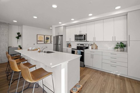Modern Open-Concept Kitchen with Island at Riverfront Everett Apartments
