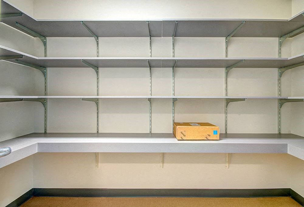Empty shelves with a box on the bottom shelf. at Ravello Apartments, Washington, 98052