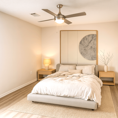 A bedroom with a bed, a ceiling fan, and two nightstands.