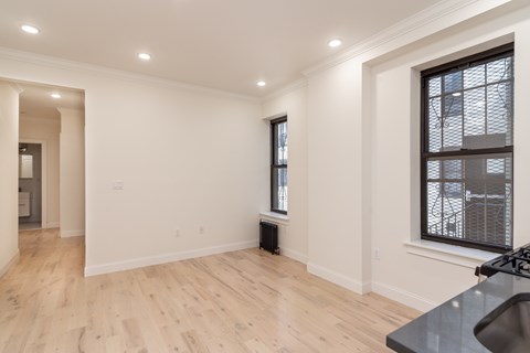 A room with a window and a sink.