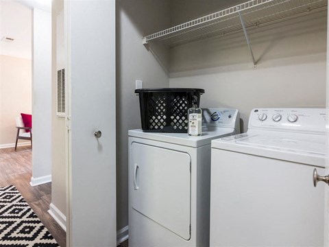 A laundry room with a washer and dryer.