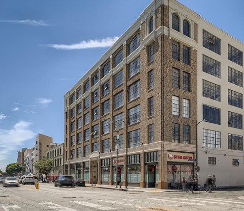 A large brick building with a Star Gifts store on the ground floor.