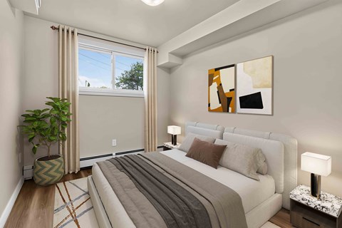 A bedroom with a large bed, a potted plant, and a painting on the wall.