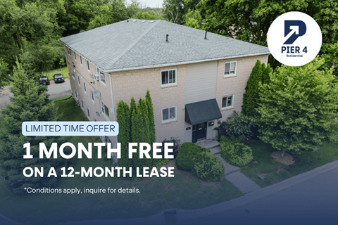 A building with a sign that says "PIER 4 Business" and "1 MONTH FREE ON A 12-MONTH LEASE".