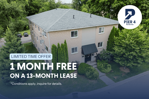 A building with a sign that says "PIER 4 Business" and "1 MONTH FREE ON A 13-MONTH LEASE".