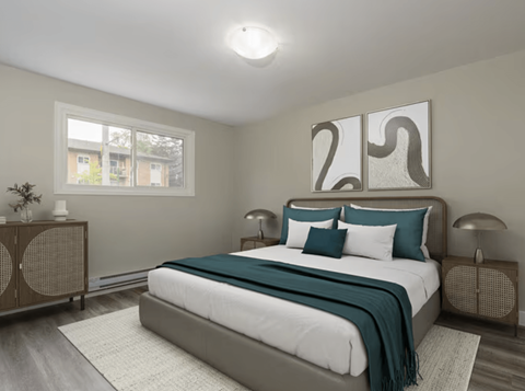 A bedroom with a large bed and a window.