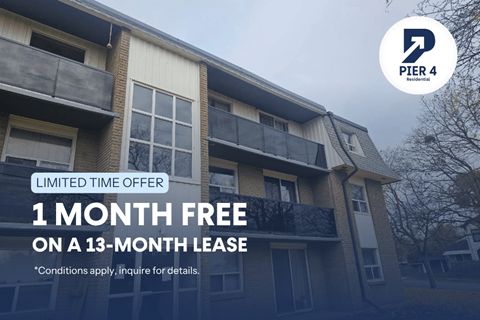 A building with a sign offering a free month on a 13-month lease.