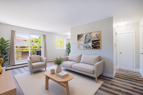 A living room with a couch, chair, and coffee table.