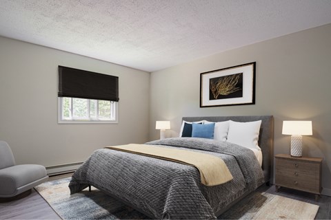 A bedroom with a large bed and a painting on the wall.