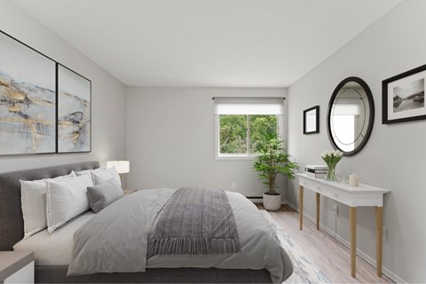 A bedroom with a large bed and a mirror on the wall.