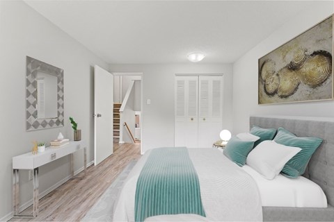 A bedroom with a bed, a dresser, a mirror, and a painting on the wall.