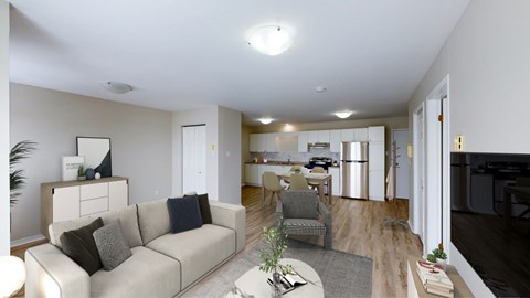 A living room with a couch, chair, and a coffee table.