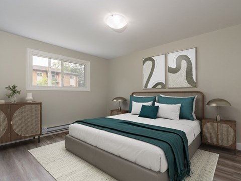 A bedroom with a large bed and a window.