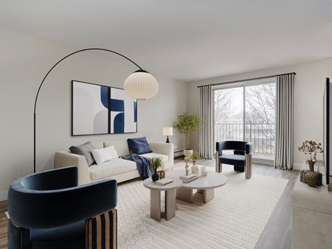 A modern living room with a large window and a blue chair.