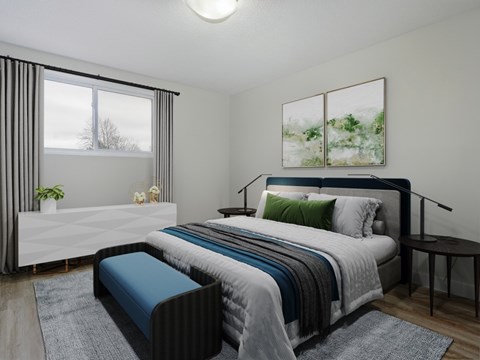 A bedroom with a large bed and a window with curtains.