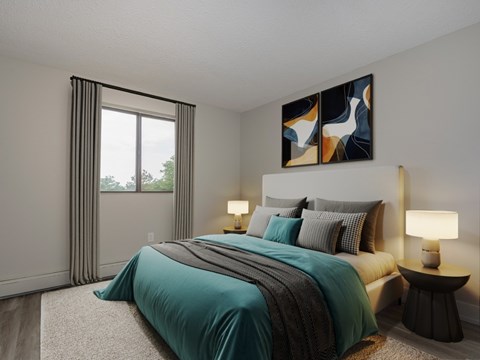 A bedroom with a large bed and a painting on the wall.