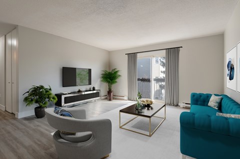 A living room with a grey chair, a blue couch, and a television.
