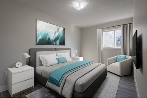 A bedroom with a large bed and a painting on the wall.