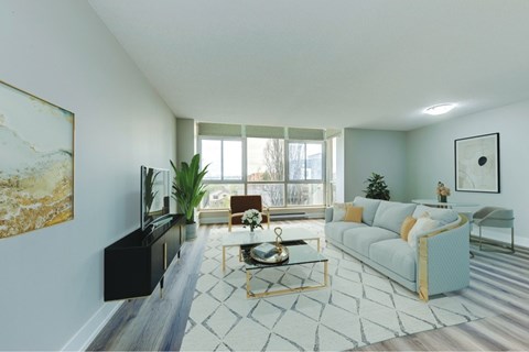 A living room with a blue couch and a coffee table.