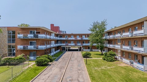 A long building with a balcony on the second floor.