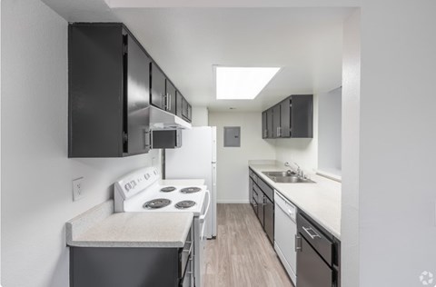 A small kitchen with a stove and a refrigerator.