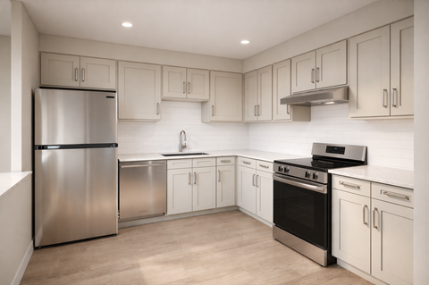 Contemporary kitchen with white shaker cabinets at The Miles Apartments, Massachusetts
