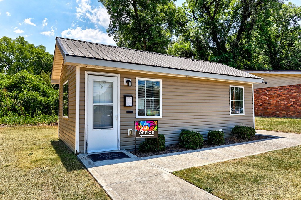 A small house with a white door.