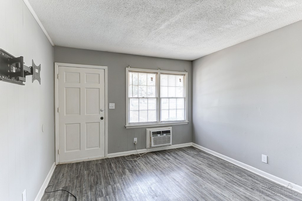 A room with a door and a window.