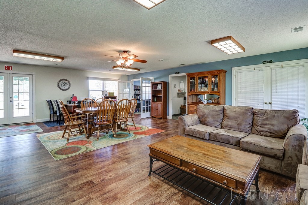 a living room and dining room with a couch and a table