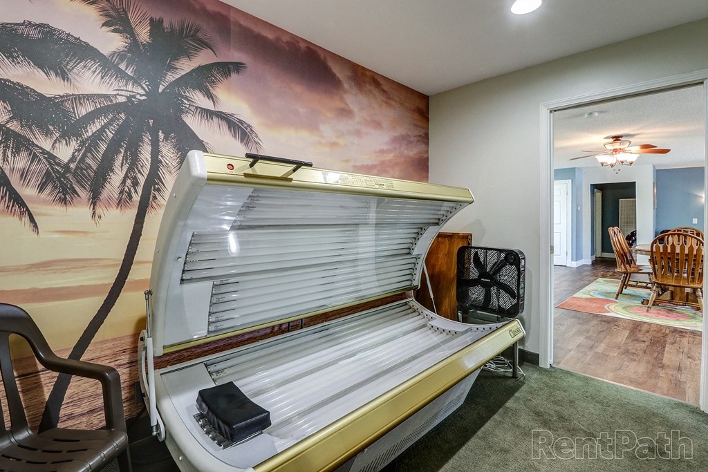 a surfboard shaped bed in a room with a wall mural
