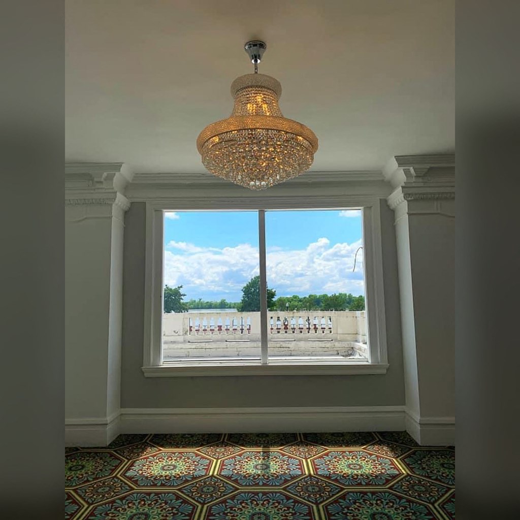 a view from the window of a room with a chandelier