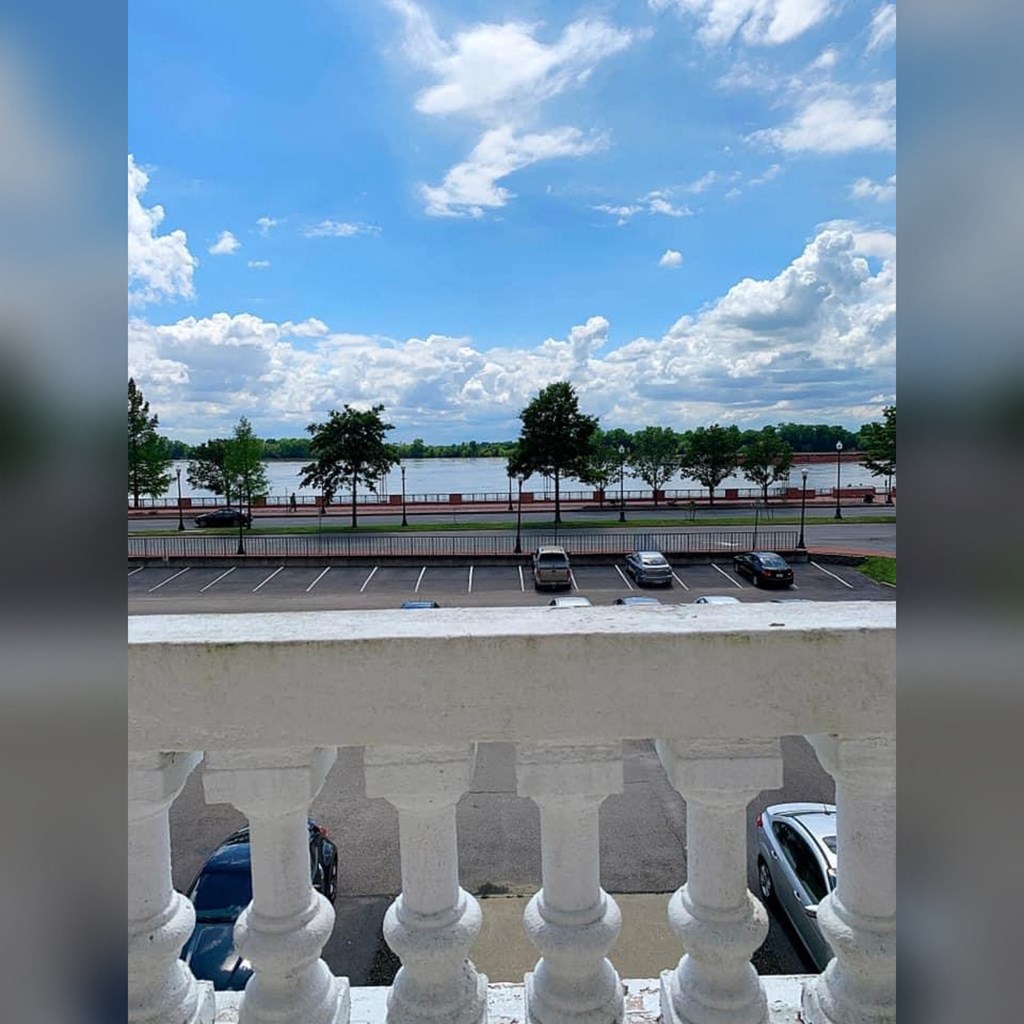 a balcony with a view of a parking lot