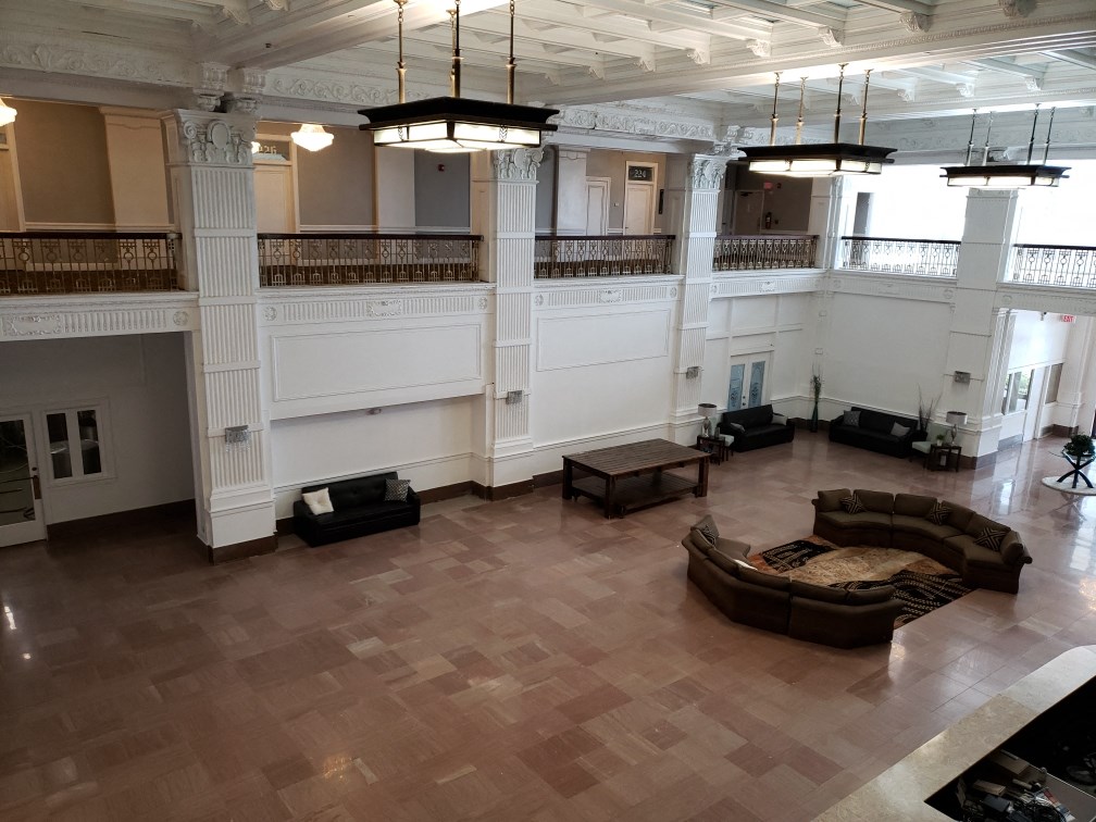 a large room with a couch and a table in the middle of it