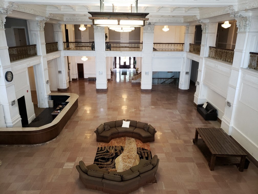 a large room with a couch and a table in the middle