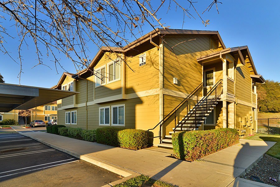 A two-story house with a staircase leading to the second floor.