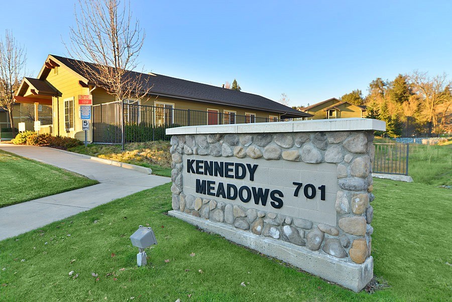 A stone sign that says Kennedy Meadows 701.