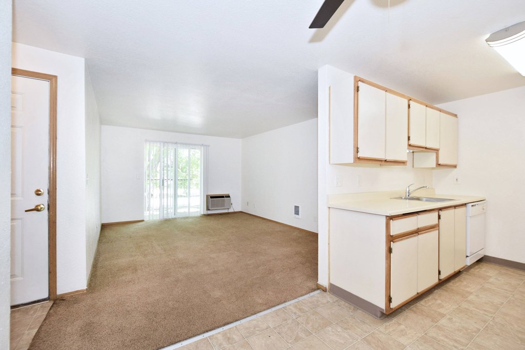 A room with a kitchenette and a window.