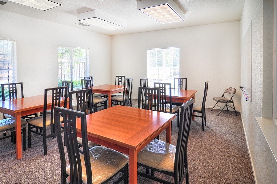 A room with tables and chairs.