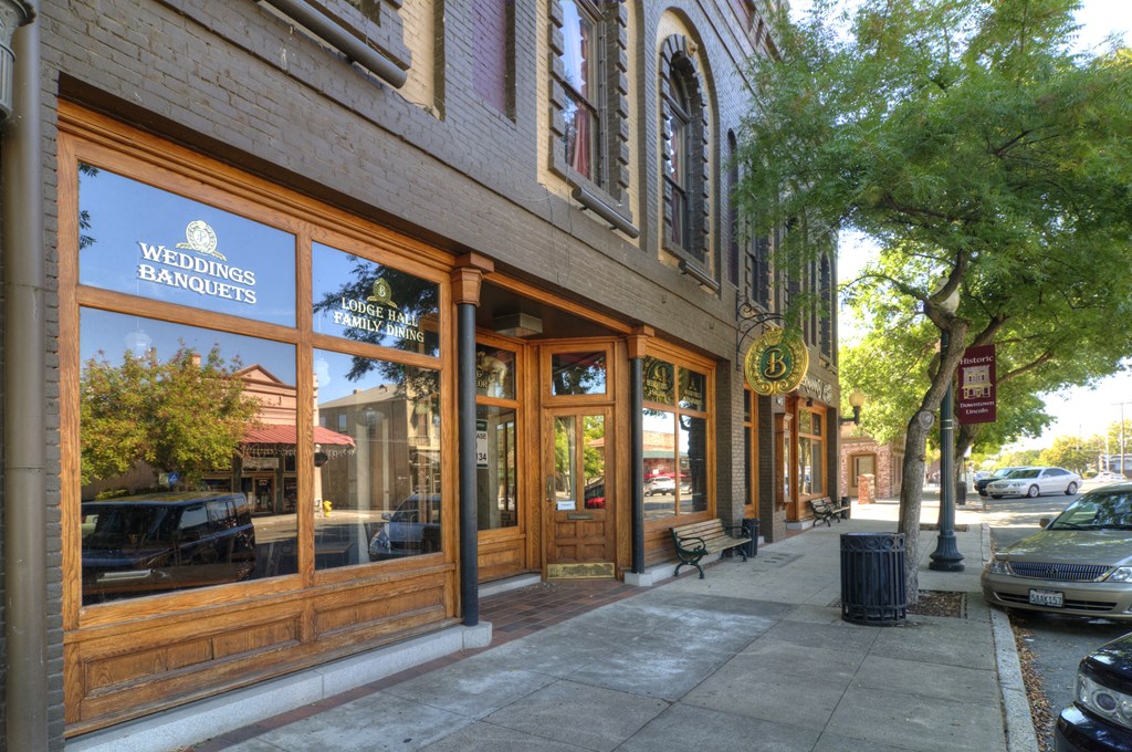 A storefront with the words "Weddings Banquets" on the window.