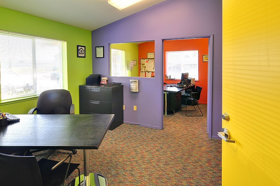 A room with a purple wall and a yellow wall.