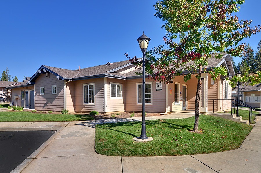 A house with a lamp post in front of it.