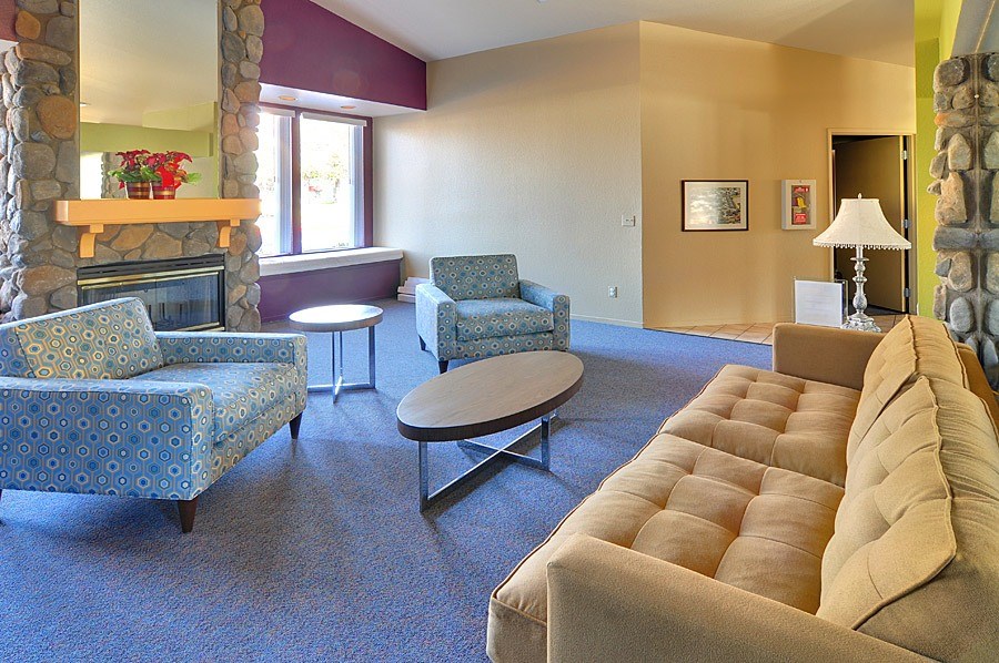 A living room with a fireplace and a couch.