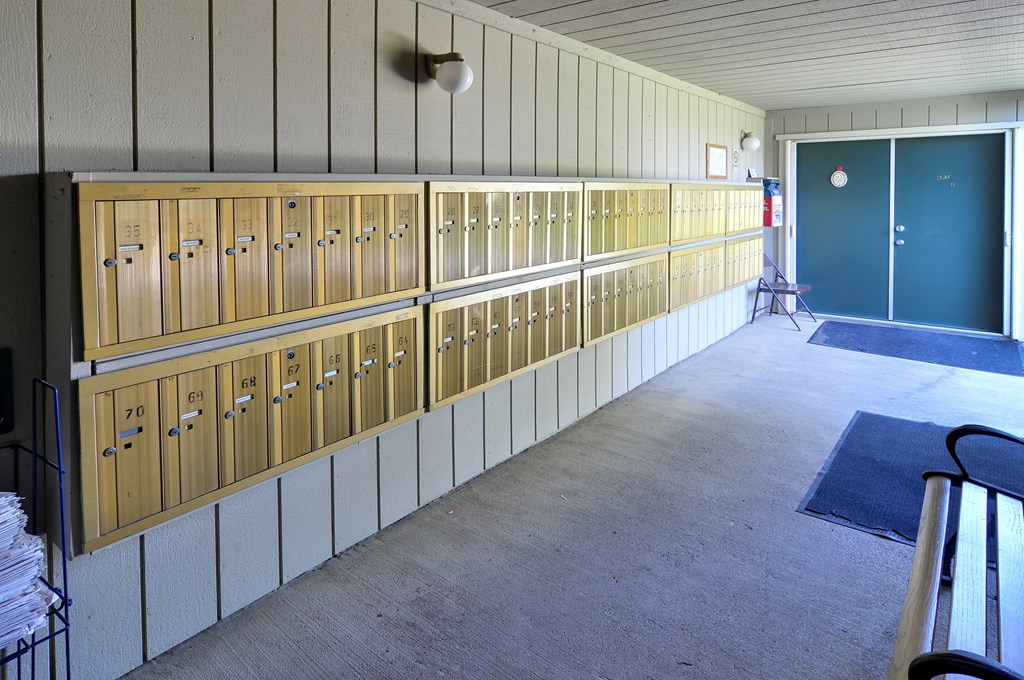 A long row of wooden lockers with the numbers 20, 21, 22, 23, 24, 25, 26, 27, 28, 29,