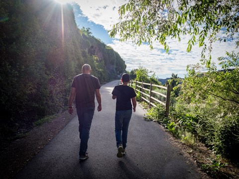 Two people walking down a path.