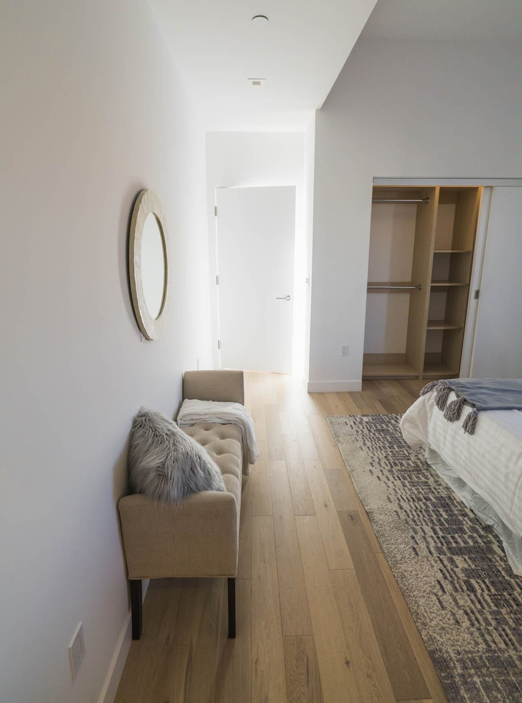 A long hallway with a chair and a rug. at The Geffen, California, 90038