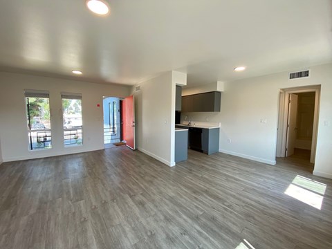 A room with a grey floor and white walls.