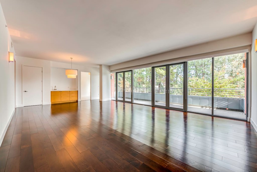 A room with wooden floors and a yellow bench.at Catania, Pasadena California