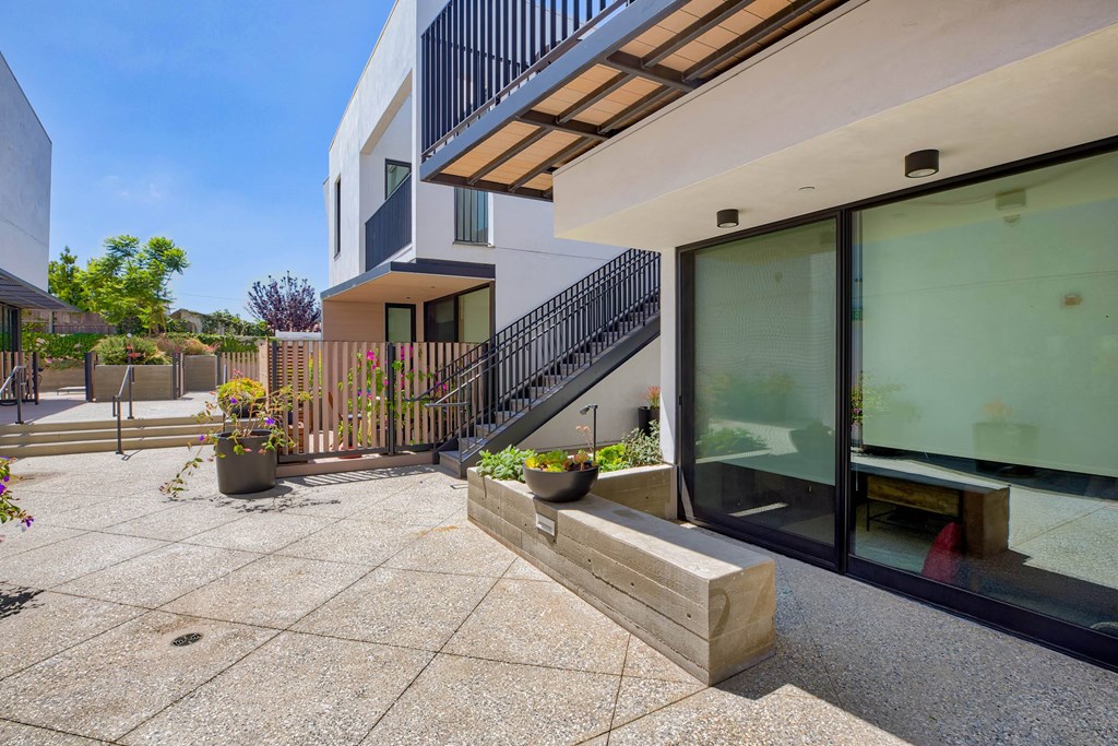 A modern house with a black metal staircase and glass doors.at 810 Ashland, Santa Monica, CA